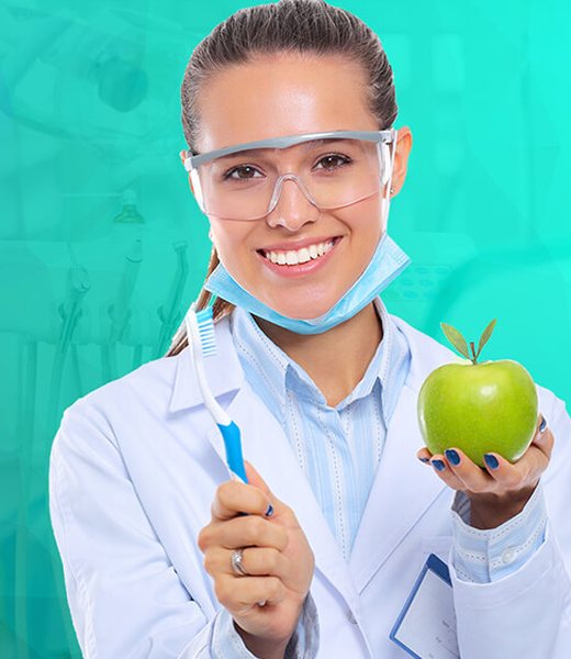 A smiling doctor holding a fresh green apple
